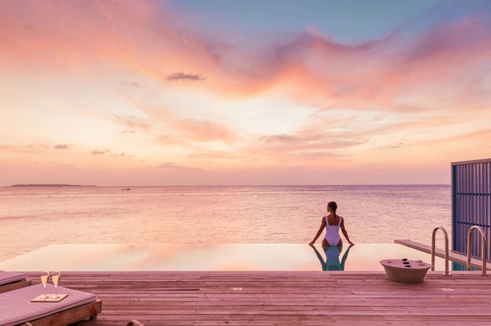 Taprobane-Leisure-Maldives-Amila-Maldives-Gallery-Sunset-Water-Villa-Woman
